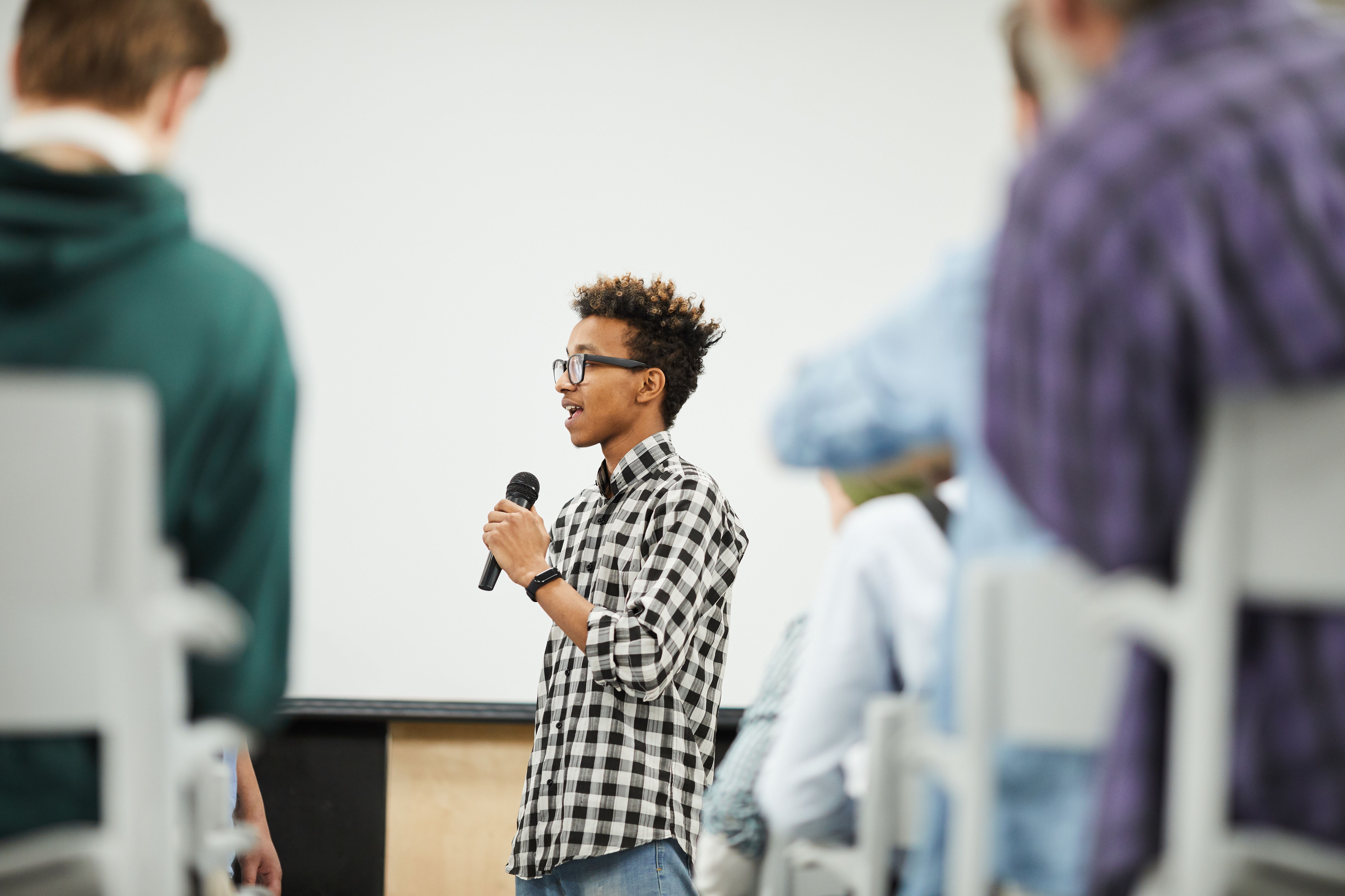 Young entrepreneur pitching at a live accelerator event